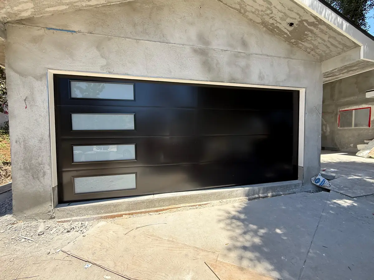 Black modern garage door with side window column