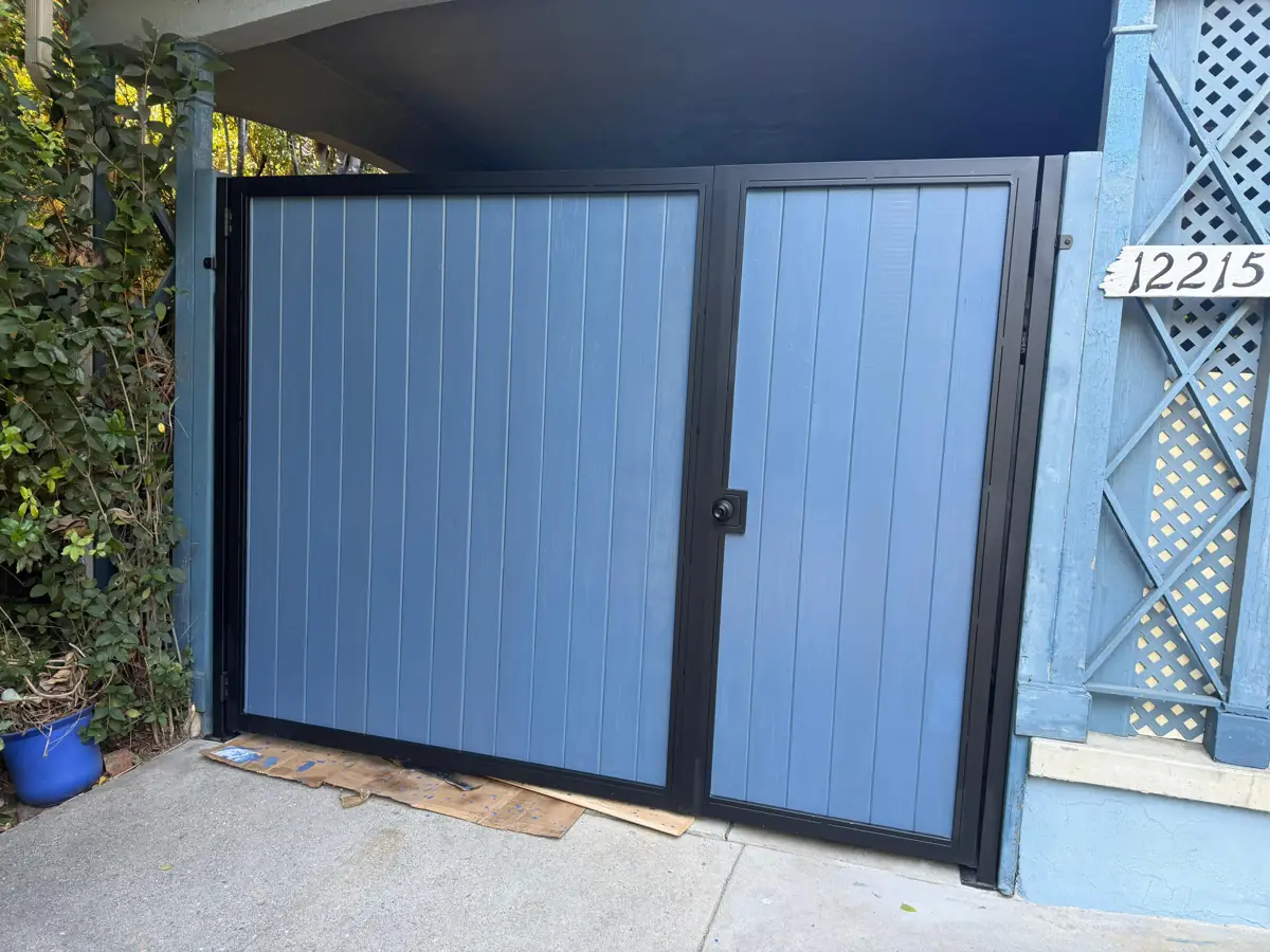 Gray panel side gate with black steel frame