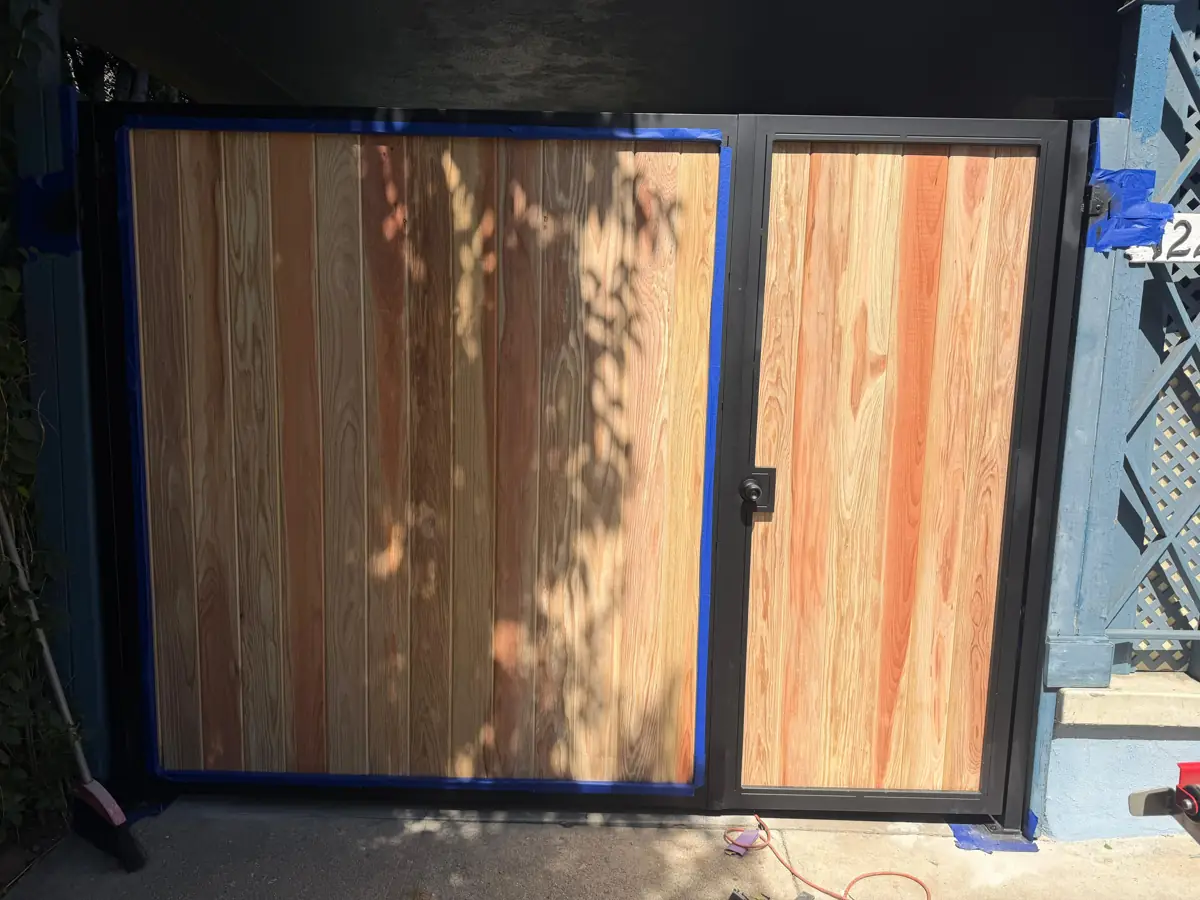 Wood side gate with black steel frame
