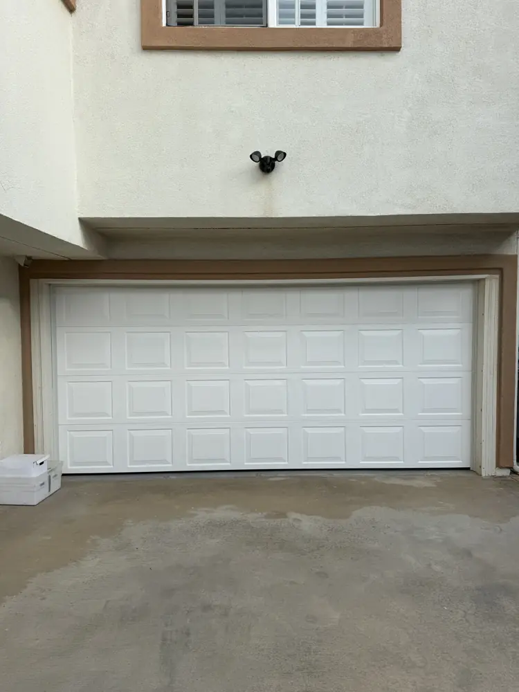 White raised-panel garage door
