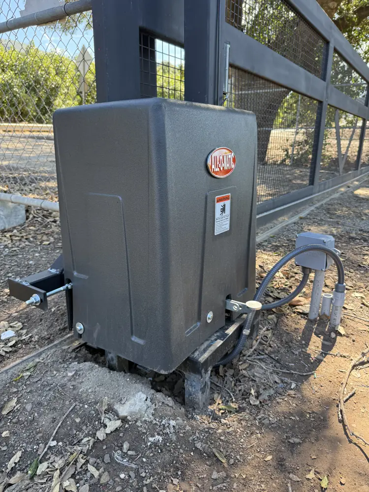 Gate operator motor mounted on a concrete pad