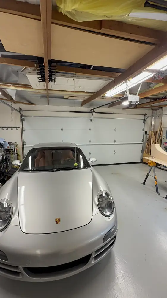 Garage interior with a sports car after a new door install