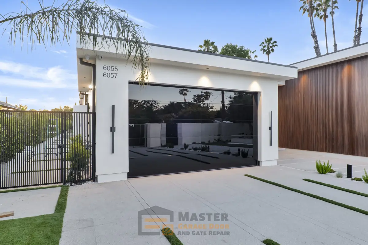 Modern black glass garage door with wall lights
