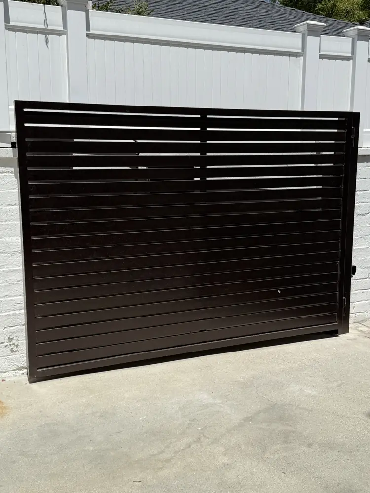 Black horizontal-slat side gate