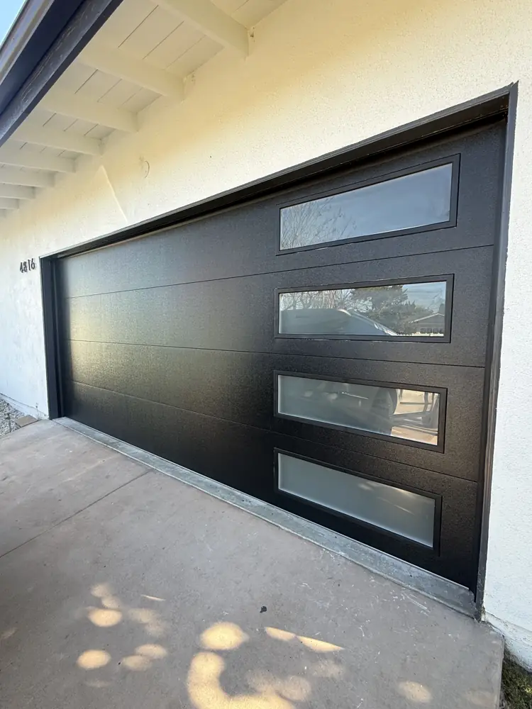 Black modern garage door with frosted windows