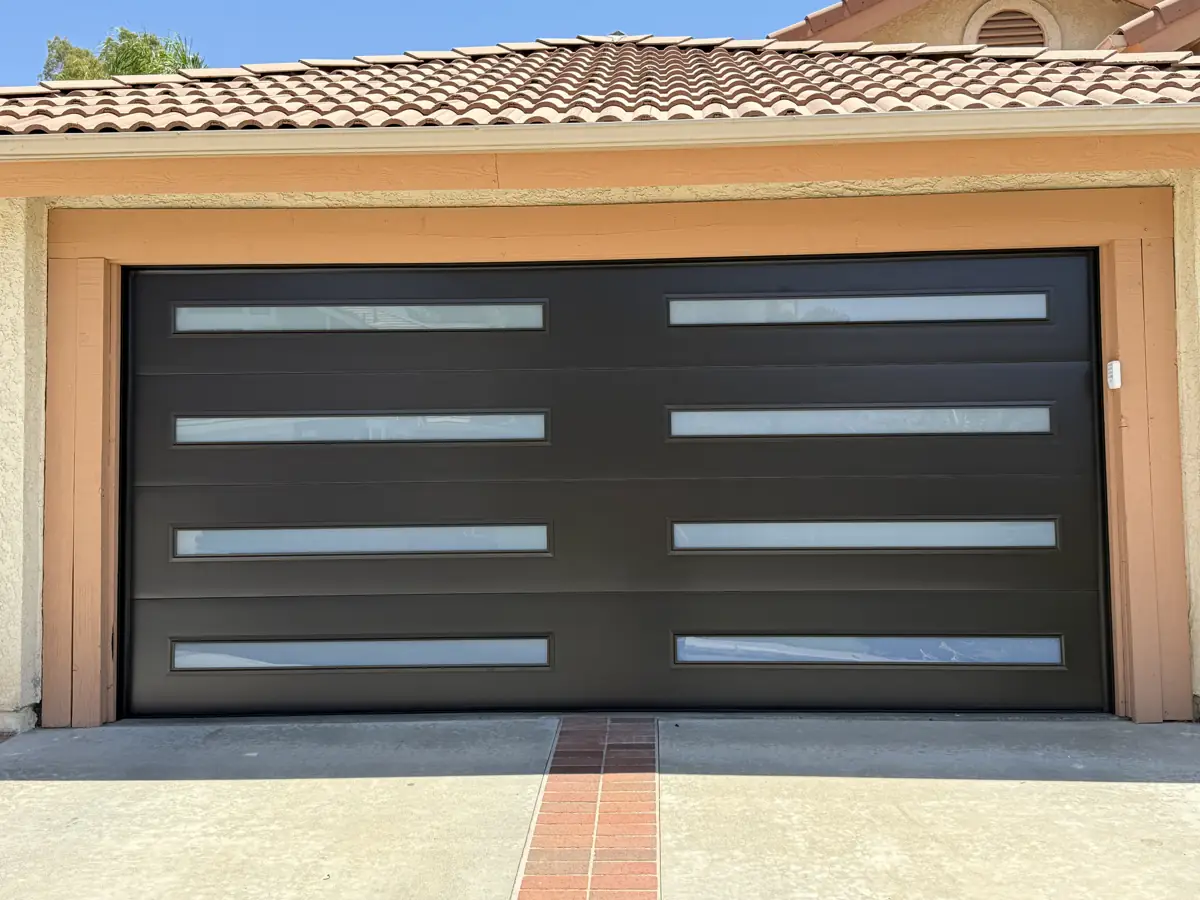 Black modern garage door with long frosted windows
