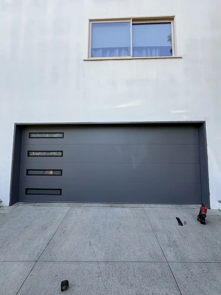 Charcoal flush garage door with side windows