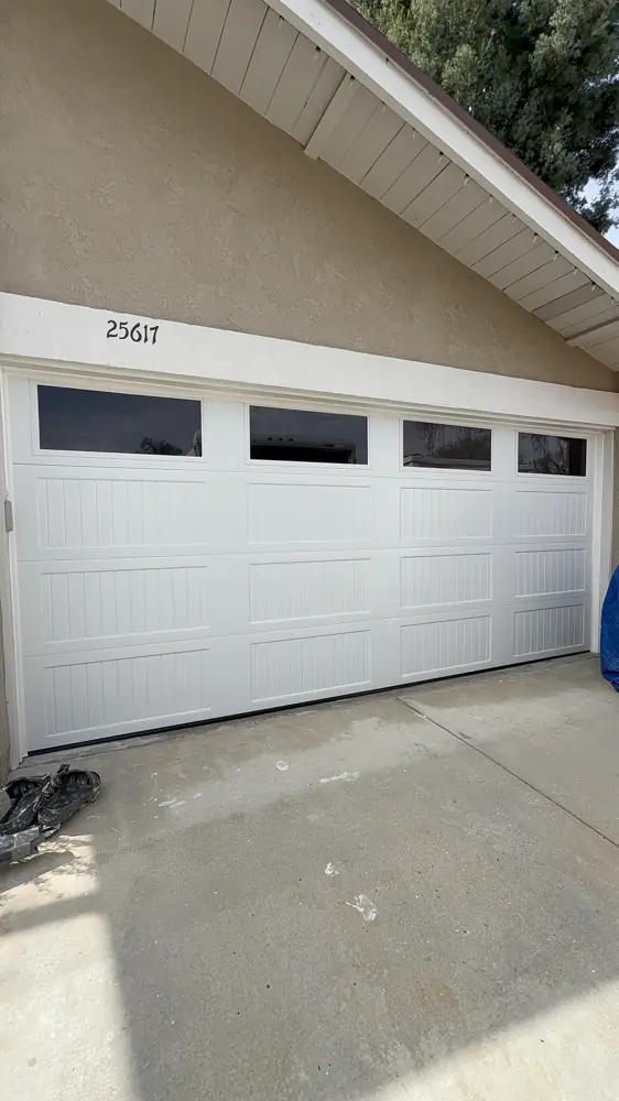 White garage door with top windows