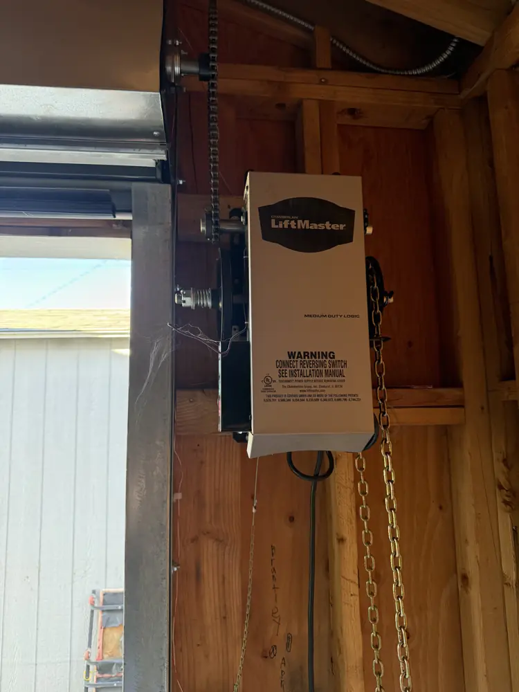 LiftMaster wall-mount jackshaft opener installed in a garage