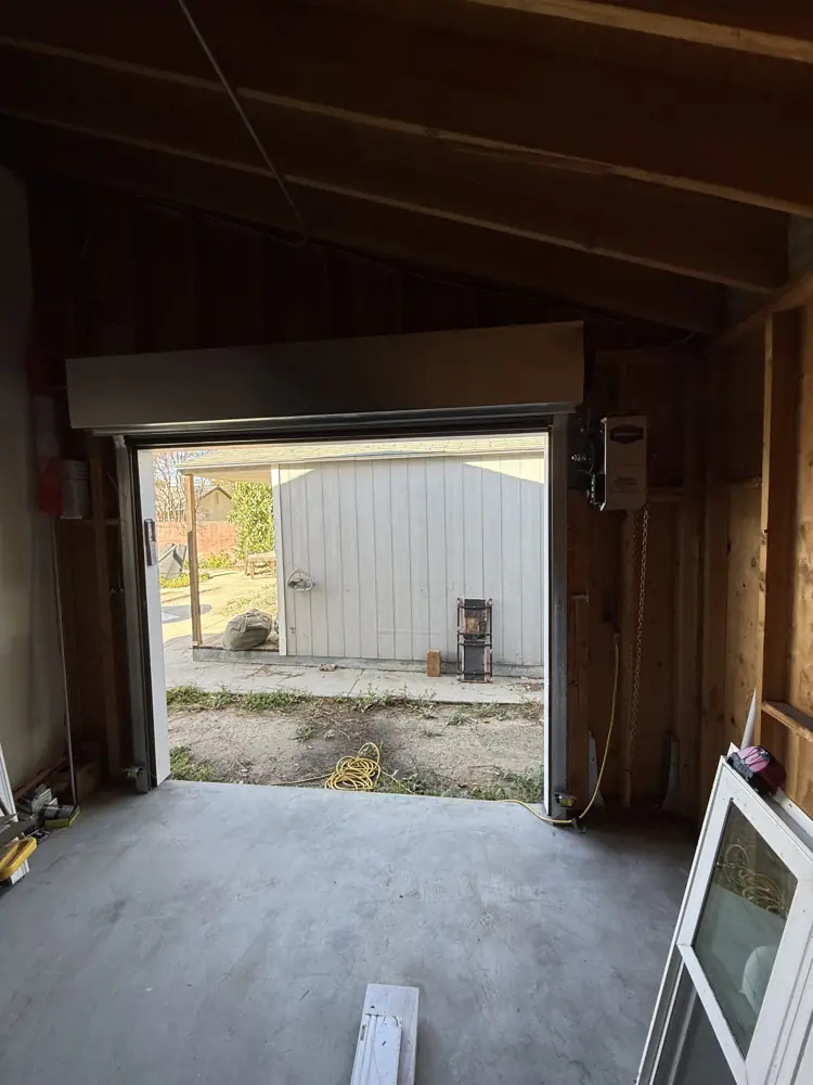 Roll-up door opening on a detached garage