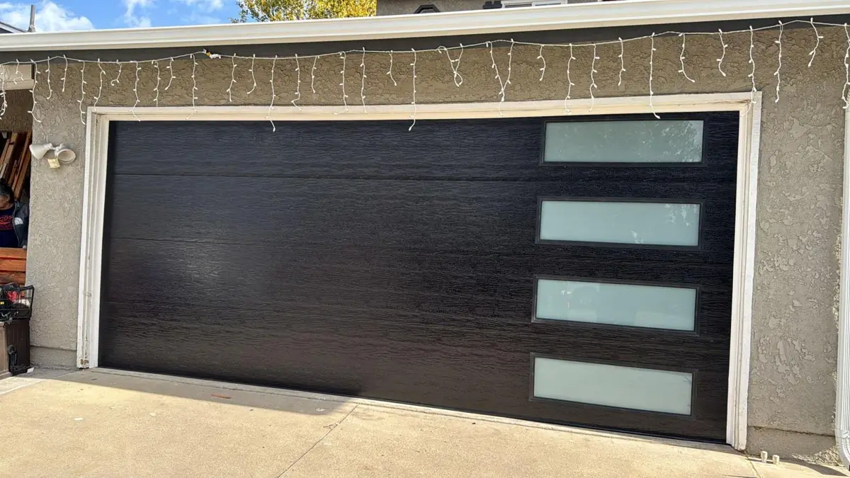 Black modern garage door with frosted windows