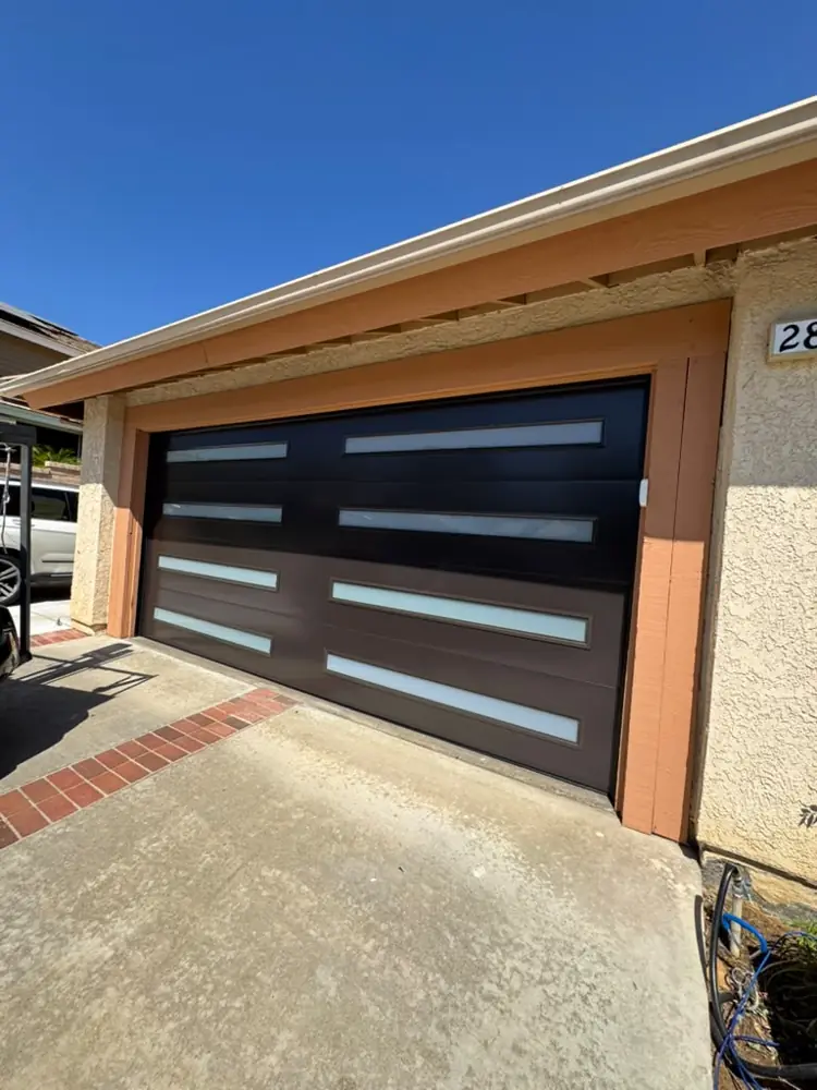 Black modern garage door with frosted windows