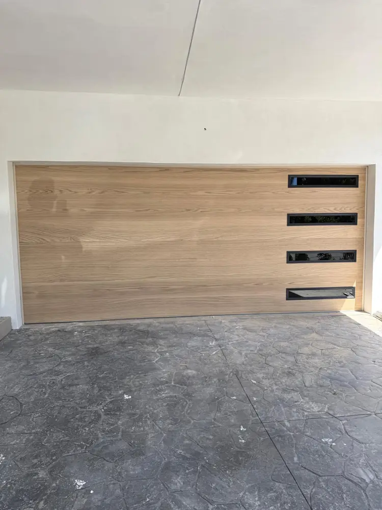Wood-look modern garage door with side windows